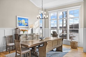 Dining Room - The dining area with bench seating and large lake-view windows sits just off the kitchen. - Fairview Lake Haven | New Waterfront Home | Private Side | 6BR/4BA | Boathouse & Dock (Mineral)