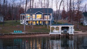 A lakeside house with a dock and a gazebo. - Fairview Lake Haven | New Waterfront Home | Private Side | 6BR/4BA | Boathouse & Dock (Mineral)