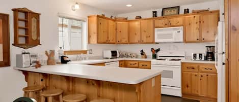 Cabaña, varias camas, patio | Cocina privada