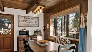A wooden interior with a sign reading 'Welcome to our LAKE HOUSE BIG BEAR LAKE - CALIFORNIA EST. 2025.' - 2594-willow Bear Lodge (Big Bear Lake)