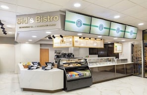 A Starbucks coffee shop with a counter, menu boards, and a display case. - Orlando Studio Villa Near Disney - Westgate Lakes (Orlando)
