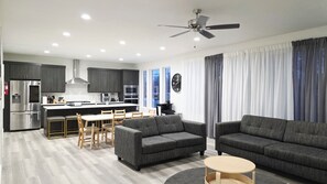 Smart TV, fireplace, books, computer monitors