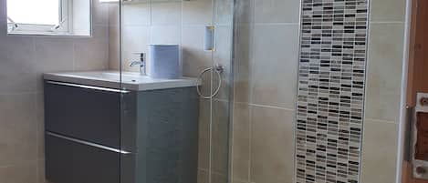 Shower, hair dryer, towels, soap