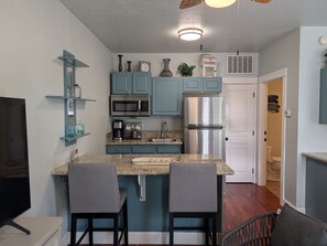 Fridge, microwave, stovetop, coffee/tea maker