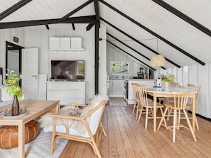 A spacious attic with a dining area, kitchen, and a television. - "Petkana" - 4km from the sea by Interhome (Eskebjerg)