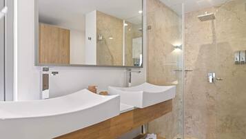 Shower, hair dryer, towels, shampoo