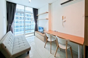 Standard Apartment | Living room - Wooden Touch 1Br At Brooklyn Alam Sutera Apartment (South Tangerang)