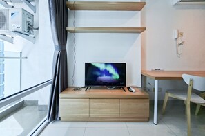 Standard Apartment | Television - Wooden Touch 1Br At Brooklyn Alam Sutera Apartment (South Tangerang)