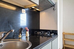 Standard Apartment | Private kitchen - Lavish White 1Br With Working Room At Pakubuwono Terrace Apartment (Jakarta)