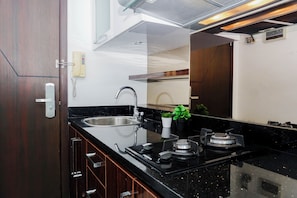 Standard Studio | Private kitchen - Homey And Warm Studio Room At Apartment Tamansari The Hive (Jakarta)