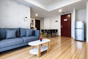 Standard Apartment | Living room - 6 Pax Tranquil 3Br With Extra Room At Grand Sungkono Lagoon Apartment (Surabaya)