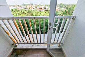 Standard Studio | Balcony - Comfy White Studio At Poris 88 Apartment (Tangerang)