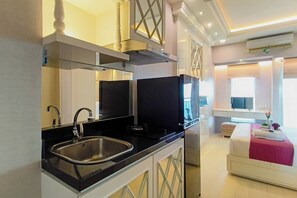 Standard Studio | Private kitchen - Studio With Good Location At Orchard Supermall Mansion Apartment (Surabaya)