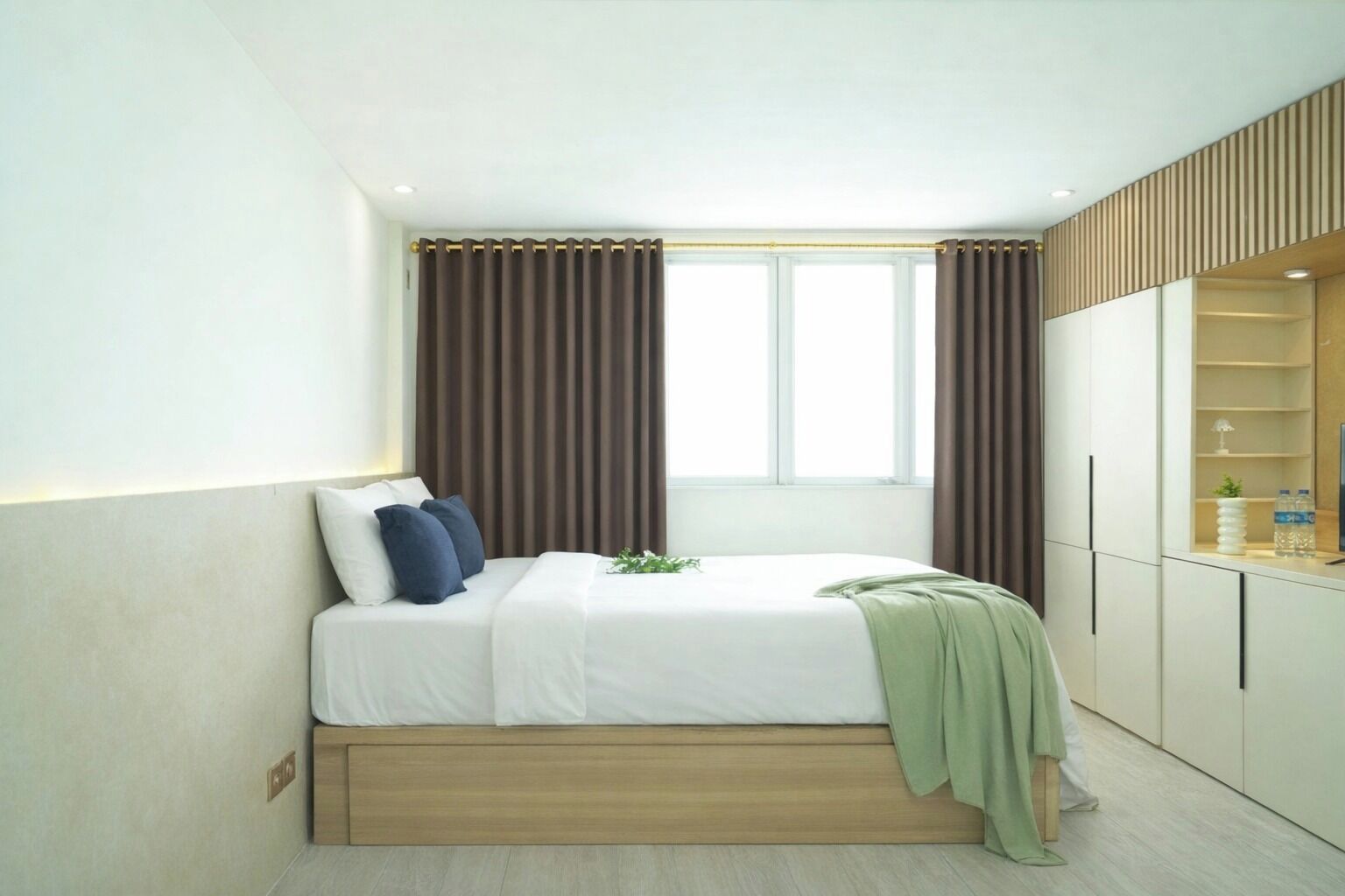 A bedroom with a bed, curtains, a window, and a wardrobe.
