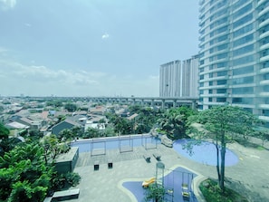 Standard Studio | City view - Restful Wooden Touch Studio At Apartment Grand Kamala Lagoon (Bekasi)