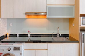 Standard Studio | Private kitchen - Peaceful Beige Studio At Menteng Park Apartment (Jakarta)