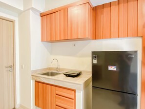 Standard Apartment | Private kitchen - Homey Wooden Touch 2Br At Apartment Meikarta District 1 (Cikarang)