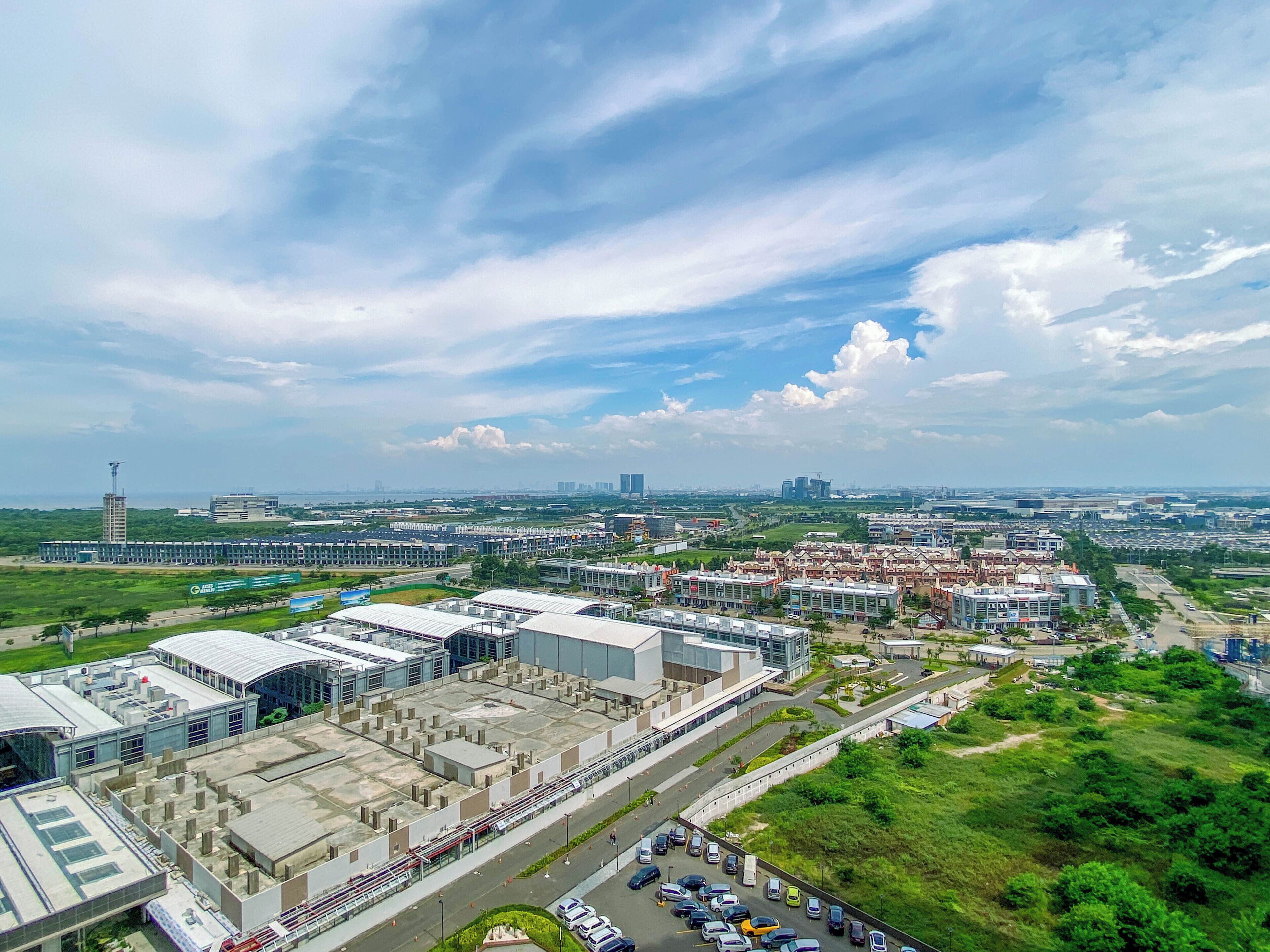 A large industrial area with multiple buildings, roads, and parking lots.
