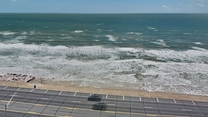 A coastal view with a paved area in the foreground. - Ocean Grove PH 1101 - The Sky Gallery Penthouse (Galveston)