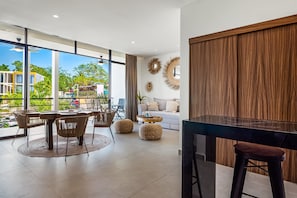 Apartment, 1 Double Bed with Sofa bed, Patio, Pool View (Araquuna F203) | Living area - Serene Gated Retreat With Pool & Lush Gardens Your Perfect Couple Getaway (Nuevo Nayarit)