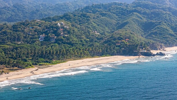 A coastal landscape with a beach, ocean, and forested hills. - Tranquil Retreat With Pool, Views of the Ocean, Close to Beach (Sayulita)