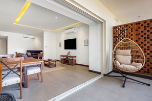 Condo, 1 King Bed with Sofa bed, Balcony, City View (V Golf 601) | Living area - Enchanting & Modern Beach Retreat With Pool, Gym, & Breathtaking Balcony Views (Puerto Vallarta)