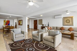 Apartment, Multiple Beds, Pool Access, Ocean View (Grand Miramar A601) | Living area - Elegant Bayview Suite With Terrace Access, Full Kitchen, Pool, hot tub & gym (Puerto Vallarta)