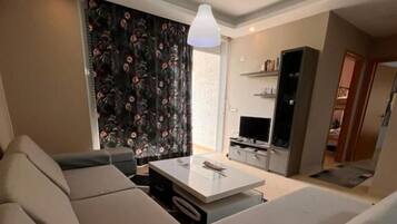 Familienapartment, Balkon, Strandblick | Wohnbereich