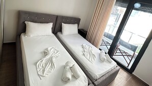 패밀리 아파트, 발코니, 해변 전 망 | 방음 설비, 무료 WiFi, 침대 시트