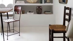 A room with a white bookshelf, two chairs, a mirror, and a window. - 2 Bedroom Steps 2 Sand Oceanview Beach Retreat (Marina del Rey)