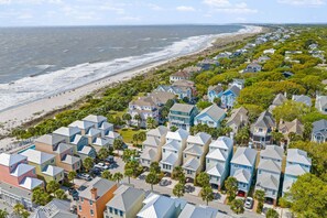 A coastal residential area with houses, a beach, and a clear sky. - New Listing! 105 Grand Pavilion - Remodeled! (Isle of Palms)