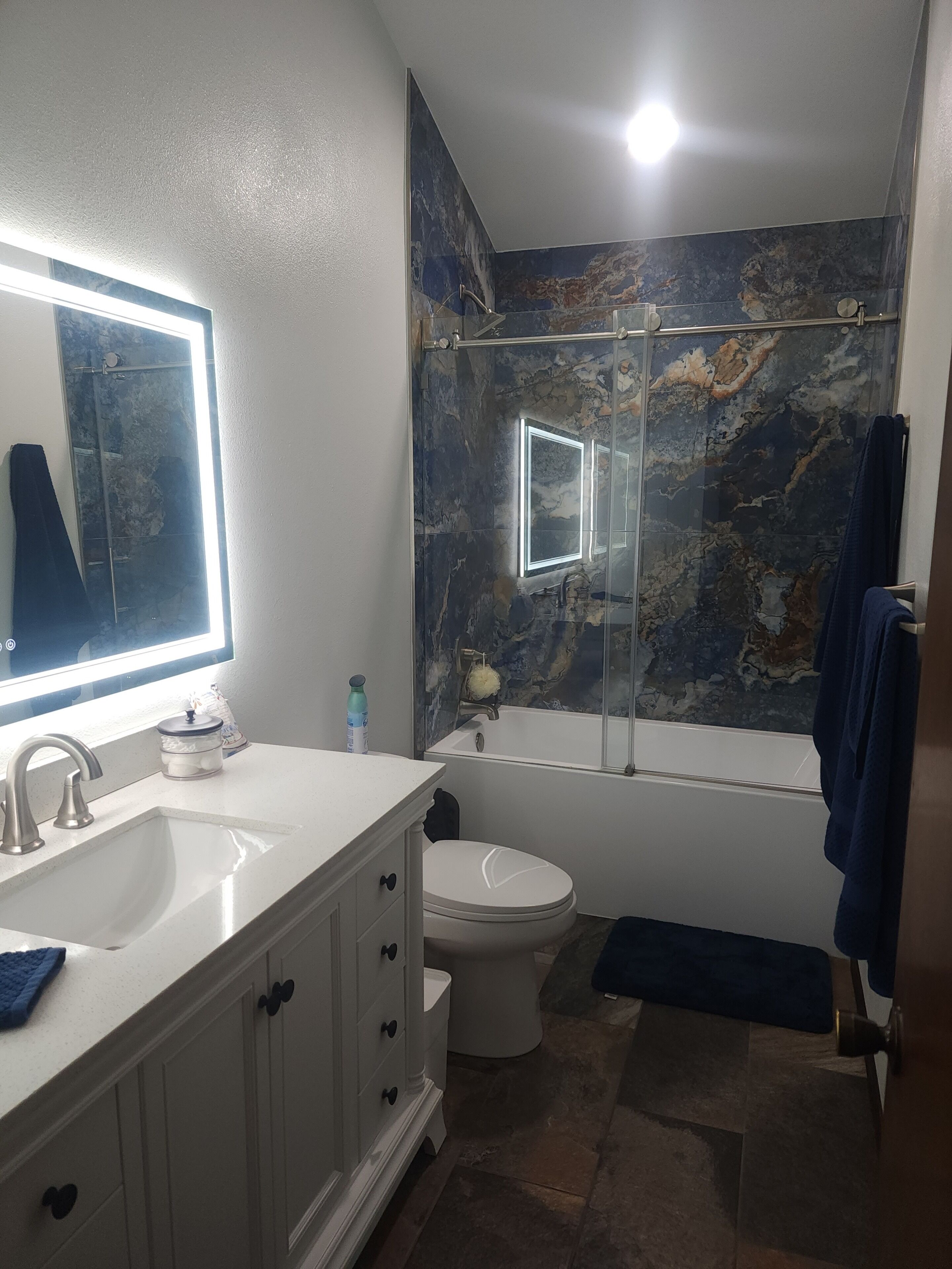 Shower, hair dryer, towels, toilet paper