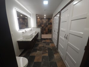 Shower, hair dryer, towels, toilet paper