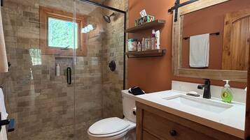 Shower, towels, soap, toilet paper