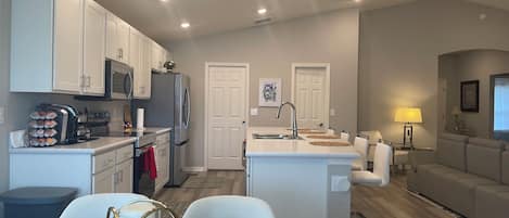 Coffee/tea maker, fridge, microwave, oven