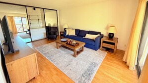 A living room with a sofa, coffee table, and lamps. - Elevator, Private Parking
Balcony, CalKingBed
Entire rental unit in Wanut creek (Walnut Creek)