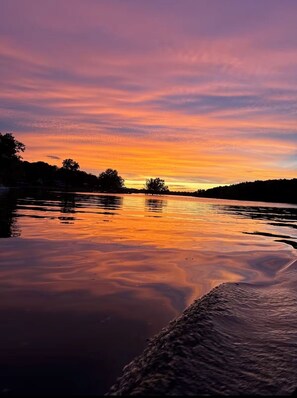 A calm river at sunset with a clear sky. - Grand Lake Hideout (Jay)