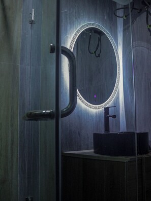 A bathroom with a mirror, sink, and door. - Luxury 2Bedroom 2Bathroom  Wuse 2 - 247 Power Free Wi-Fi (Abuja)