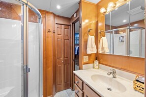 Shower, hair dryer, towels, soap