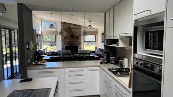 Coffee/tea maker, fridge, microwave, oven