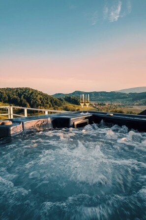 A hot tub with a view of a hilly landscape. - Herb haven｜Exclusive Cottage with Jacuzzi and Sauna (Zgornja Kungota)