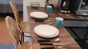 A dining table set with plates, cutlery, and a mug. - Our guests appreciate the excellent location, comfort, service, and Wi-Fi (Oaxaca de Juárez)