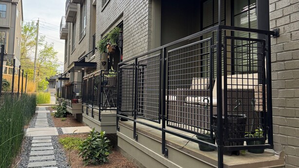 A residential building with a brick facade, a stone pathway, and a metal railing along the front. - FIFA 2026 RETREAT - 2BR Sleeps 6 - Bikes - BeltLine to Stadium - Walkable (Atlanta)
