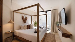 Un dormitorio moderno con una cama con dosel, un televisor montado y un amplio ventanal con cortinas.
