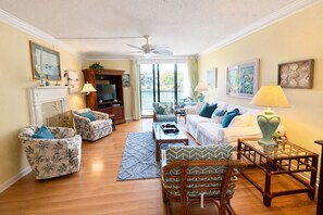 TV, books - Island Club 105 Beach Condo | Lagoon Views (Hilton Head Island)