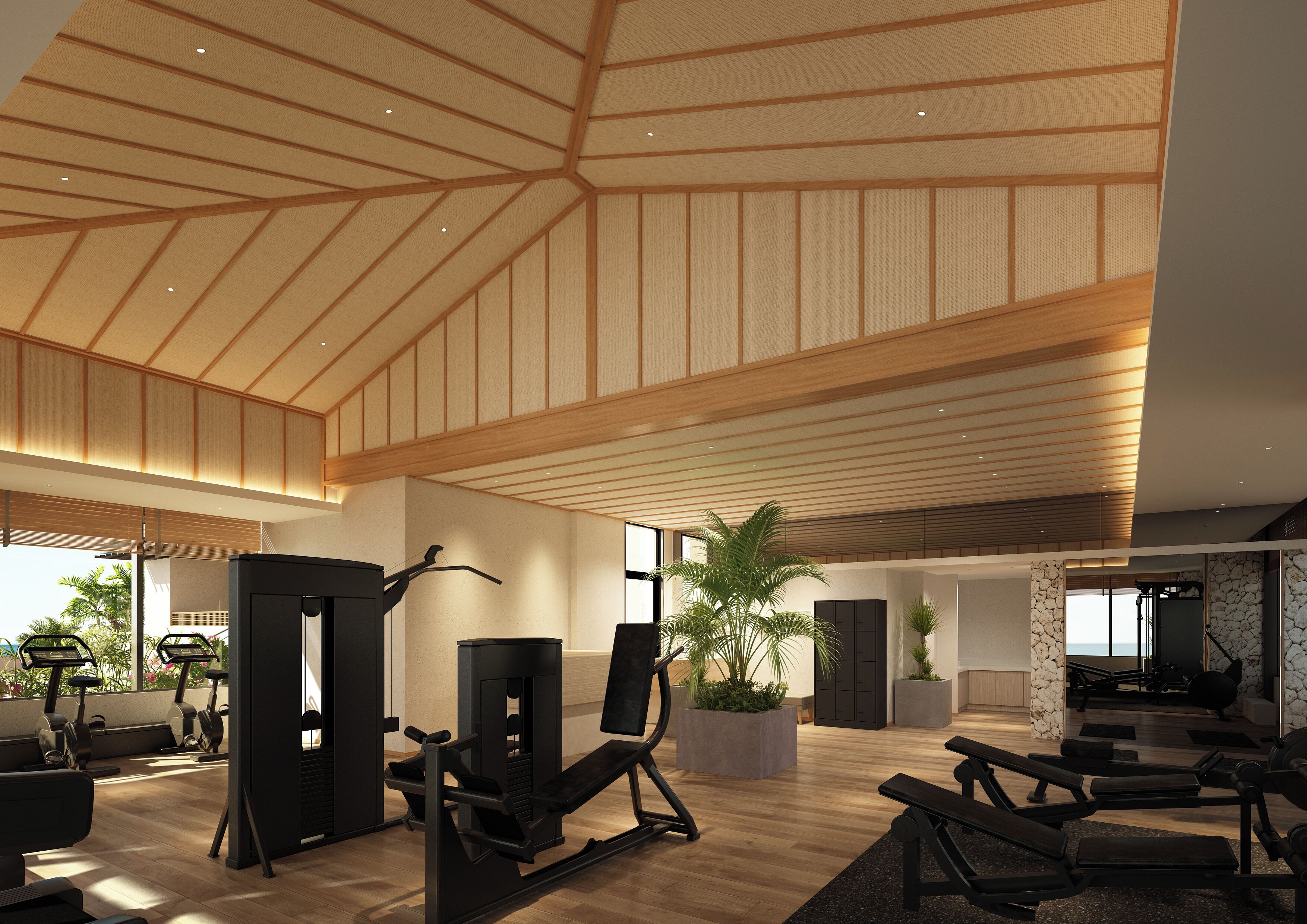 A spacious gym with various exercise equipment, a high ceiling with wooden beams, and large windows allowing natural light.