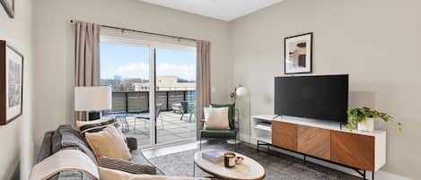 One-Bedroom | Living area | 40-inch Smart TV with digital channels