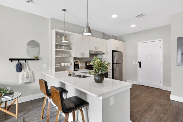 Accessible One-Bedroom | Private kitchen | Fridge, microwave, coffee/tea maker, cleaning supplies