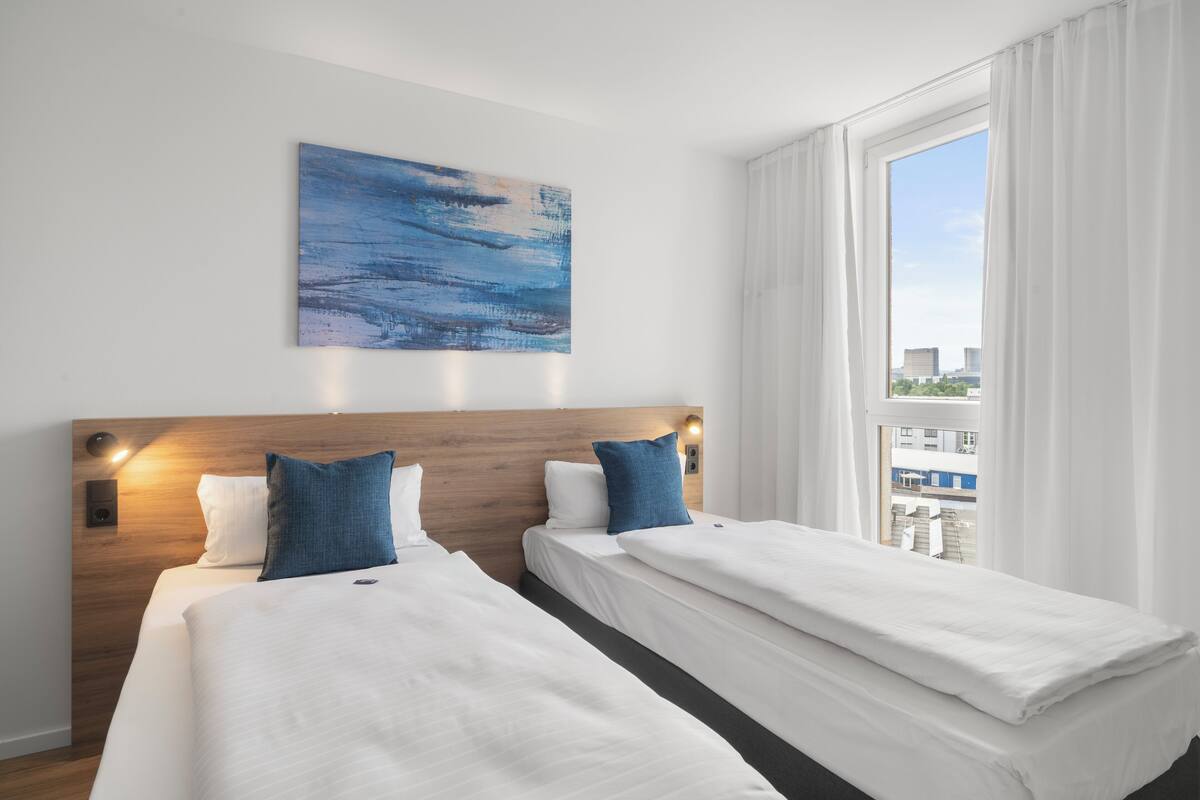 Twin Room | Free minibar, desk, laptop workspace, blackout curtains