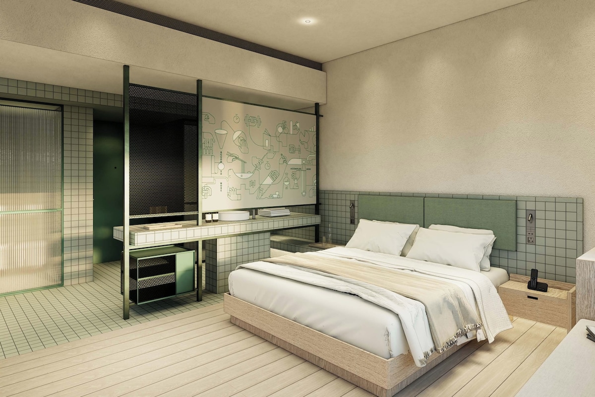 A modern bedroom with a bed, bedside table, and a wall with a grid pattern.